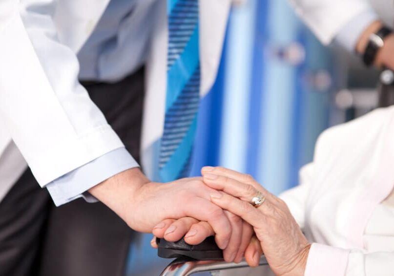 Healthcare provider comforting patient